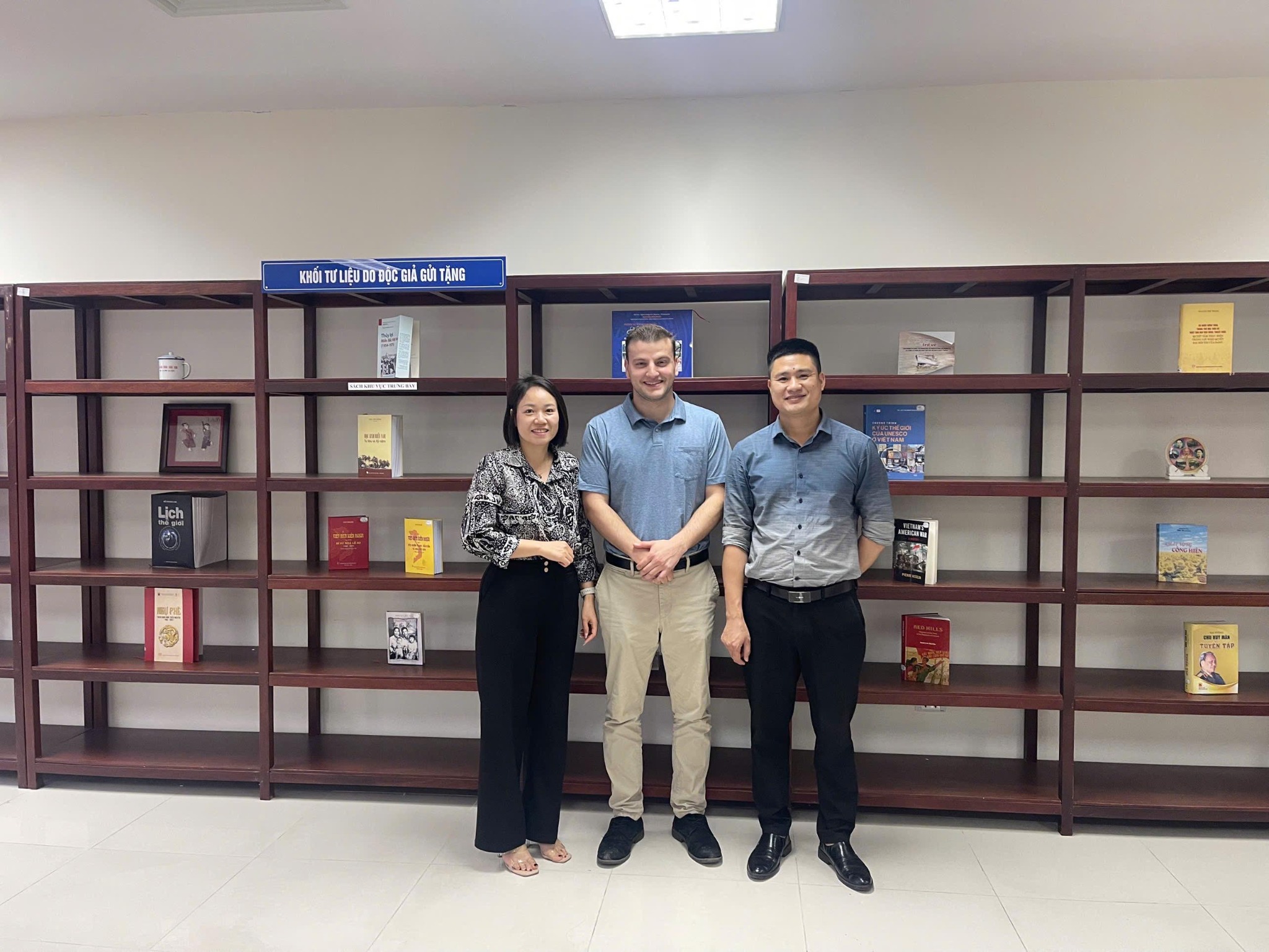 Zachary Tayler with two archivists at National Archives Center III in Hanoi